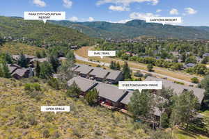 Aerial perspective of suburban area featuring a mountainous background