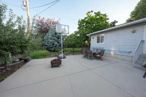 View of patio / terrace with a fire pit and outdoor dining space