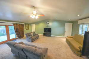 Second Living room with french doors, carpet floors, lofted ceiling, ceiling fan, and recessed lighting