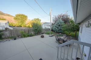 View of patio featuring a fire pit