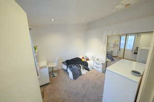 Carpeted bedroom featuring baseboards and recessed lighting