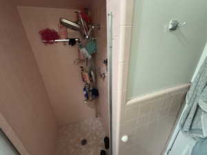 Full bathroom with a shower stall