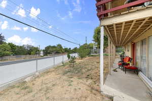Fenced backyard with a patio