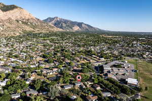 View of property location featuring nearby suburban area and mountains