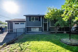View of front of property with an attached garage and driveway