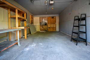 Garage featuring a garage door opener