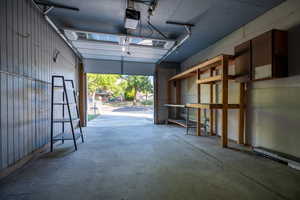 Garage featuring a garage door opener