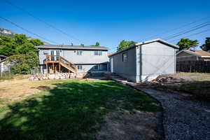 Rear view of property with stairway