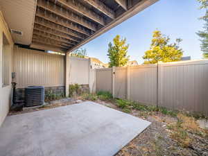 Fenced backyard with a patio