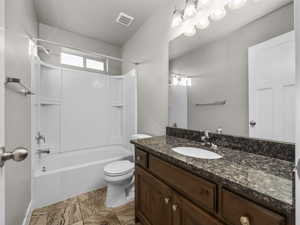 Bathroom with vanity and shower / bath combination