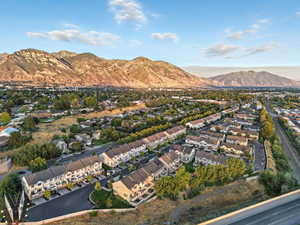 Aerial view of residential area featuring a mountain backdrop