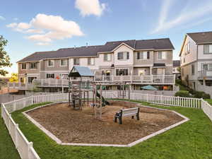 Community jungle gym featuring a residential view