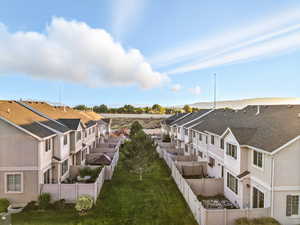 Fenced backyard with a residential view
