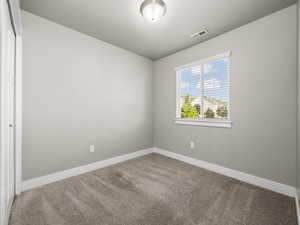 Empty room with carpet flooring