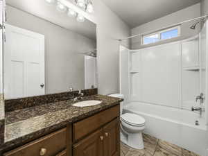 Bathroom featuring washtub / shower combination and vanity