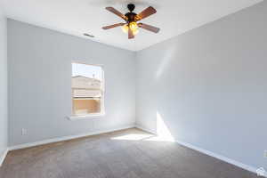 Unfurnished room with carpet and ceiling fan