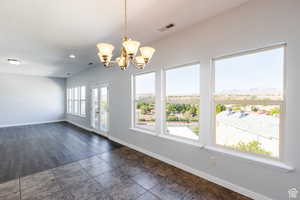 Spare room featuring a chandelier and recessed lighting