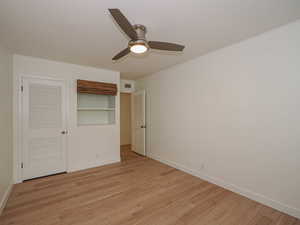 Unfurnished bedroom featuring light wood-style flooring, ceiling fan, and a closet