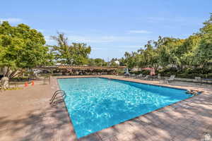 Community pool with a patio area