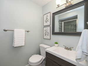 Bathroom with vanity and a tile shower