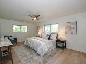 Bedroom featuring light wood-style floors and a ceiling fan