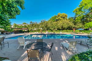 Community pool featuring a patio area