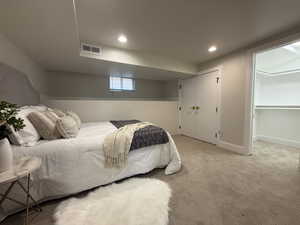 Bedroom featuring light carpet and recessed lighting