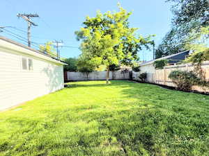 View of fenced backyard