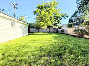 View of fenced backyard