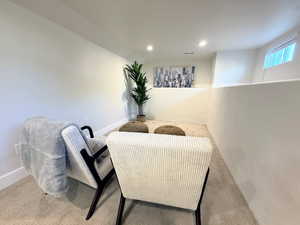 Sitting room featuring recessed lighting and carpet flooring
