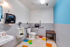 Bathroom featuring toilet and tile patterned floors