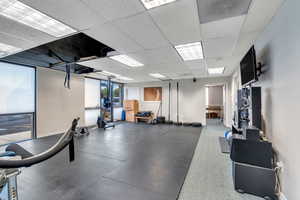 Workout area featuring a drop ceiling