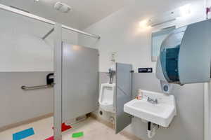 Bathroom with baseboards and a sink