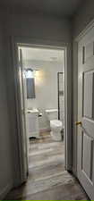 Bathroom featuring wood finished floors and vanity