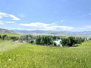 View of mountain background featuring a nearby body of water