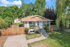 View of bungalow-style house with view of workshop