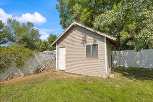 View of outbuilding featuring a fenced backyard