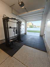 Workout area featuring a garage
