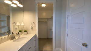 Bathroom featuring vanity and baseboards