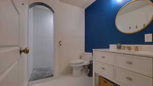 Full bathroom featuring vanity, tile patterned floors, and a shower