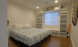 Bedroom featuring dark wood finished floors and recessed lighting