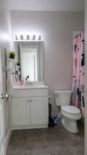 Bathroom featuring toilet and vanity