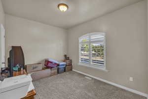 Bedroom with carpet and baseboards