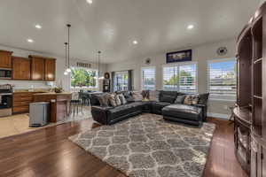Living room featuring light wood finished floors and recessed lighting