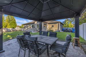 Fenced backyard featuring outdoor dining area and a patio area