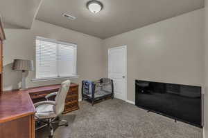 Office area featuring carpet and baseboards
