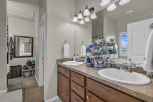 Full bathroom with double vanity and tile patterned floors
