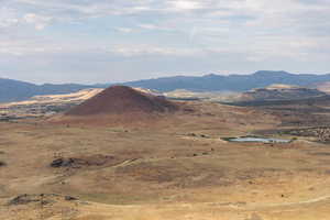 View of mountain backdrop featuring rural landscape