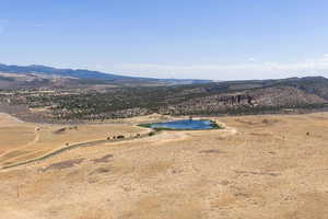 Overview of rural landscape featuring a water and mountain view