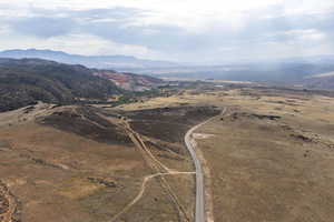 View of property location featuring a mountain backdrop and rural landscape